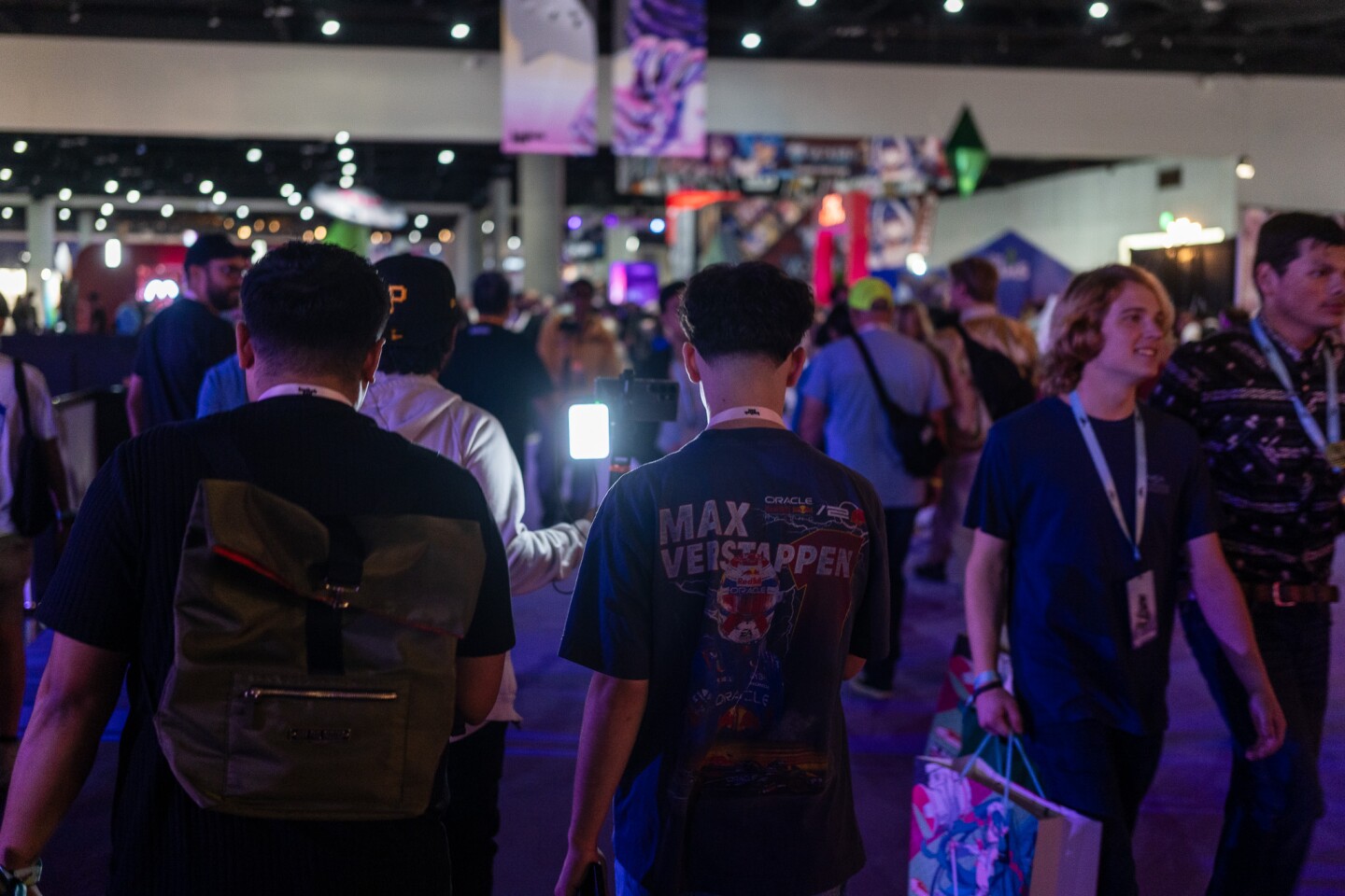 A convention attendee livestreams as he walks through the main exhibit hall at TwitchCon San Diego on Oct. 17, 2025.