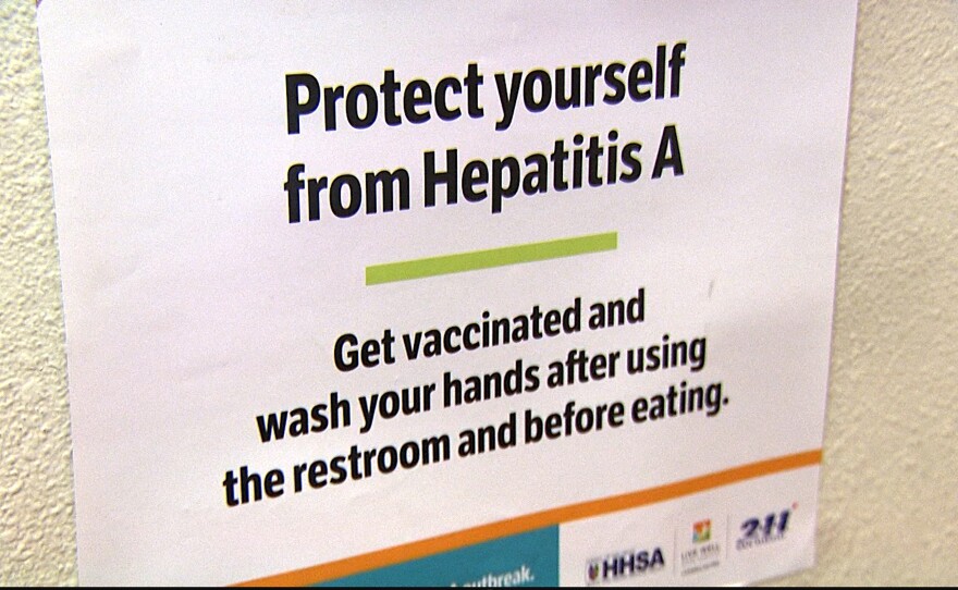 A sign in San Diego providing information about where to get hepatitis A vaccinations is shown in this undated photo.