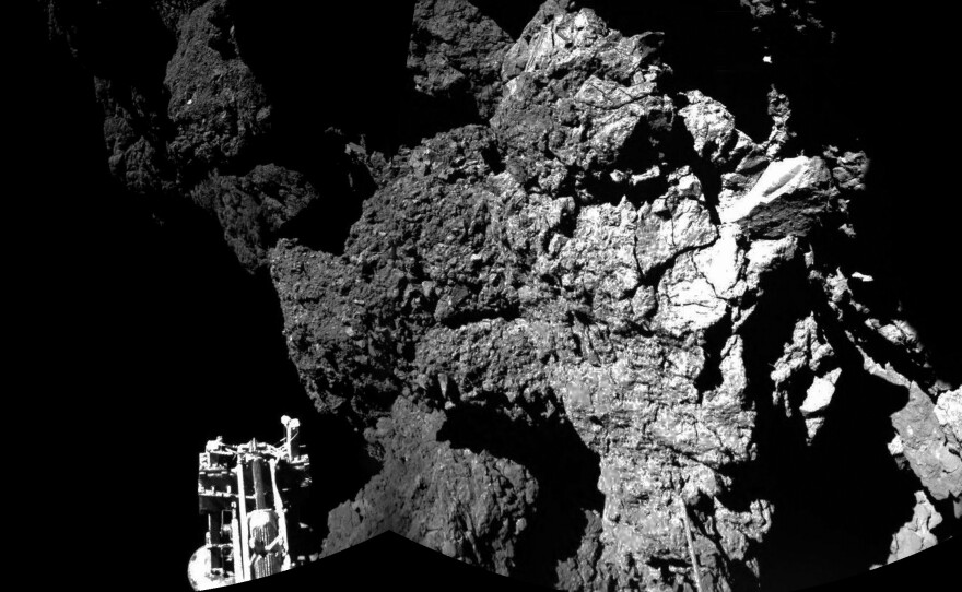 The final resting place of the Philae lander is seen here in a composite image relayed to Earth by the Rosetta orbiter. The lander is no longer communicating from comet 67P's surface.