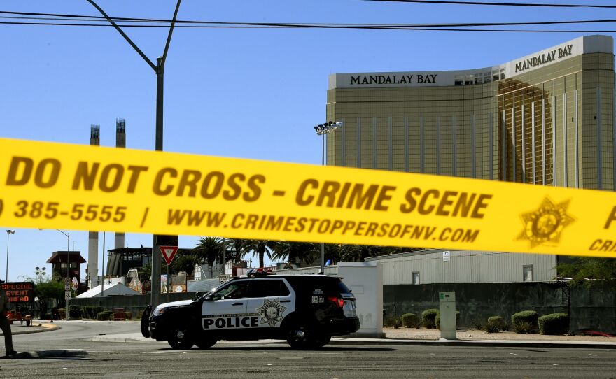 Crime scene tape surrounds the Mandalay Hotel in Las Vegas after a gunman in one of its rooms killed at least 58 people, with more than 500 others injured, when he opened fire on a country music concert late Sunday.