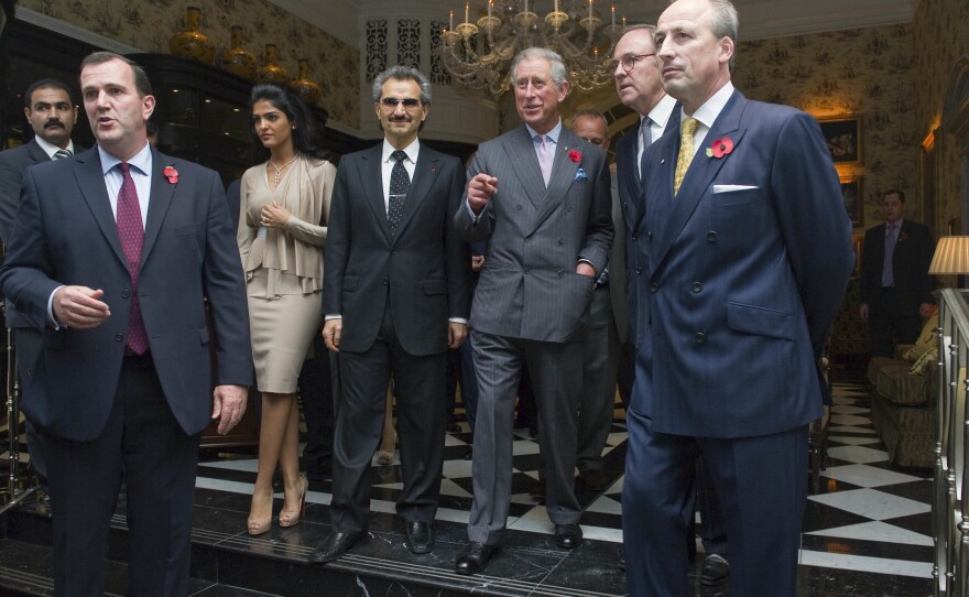 Prince Alwaleed Bin Talal (fourth from left) attends the reopening of London's Savoy Hotel in 2010 with Prince Charles.