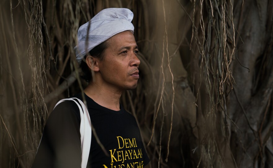 Wahjudi Djaja calls himself an ambassador of Kejawen religion. Standing in front of an old banyan tree, he says many spirits live in the tree.