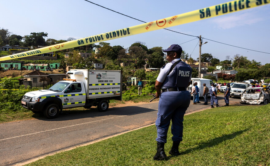 A police officer is seen at a scene of a mass shooting at a house party in KwaMakhutha township south of the city Durban, South Africa, Wednesday, Sept. 23, 2026.