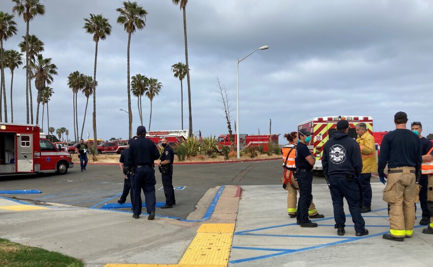 San Diego firefighters and lifeguards at the site of a panga boat rescue in La Jolla, May 20, 2021.