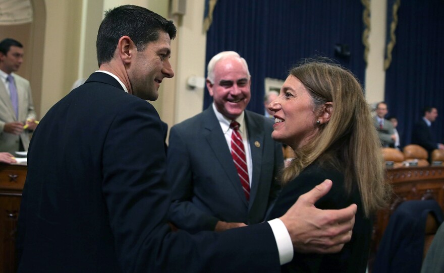 Secretary of Health and Human Services Sylvia Burwell talks before a Capitol Hill hearing Wednesday with Rep. Paul Ryan, R-Wis., as Rep. Pat Meehan, R-Pa., looks on.