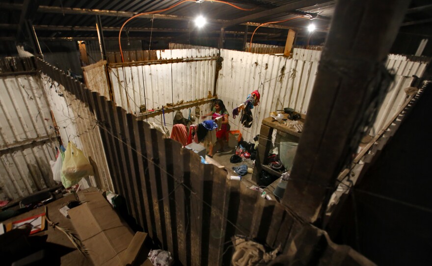 The 12-foot-by-12-foot rooms at Campo San Jose each house as many as six people, who sleep on concrete bunks nightly for months at a time. A restful night is hard to come by, as light and the sounds of crying babies and loud music spill over from adjoining rooms. Thieves jump the partitions and pilfer food, and rats scurry on the steel slats.