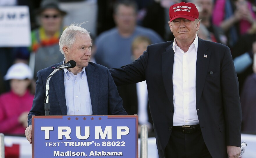 Republican presidential candidate Donald Trump, right, stands next to Sen. Jeff Sessions during a rally in Madison, Ala. on Feb. 28.