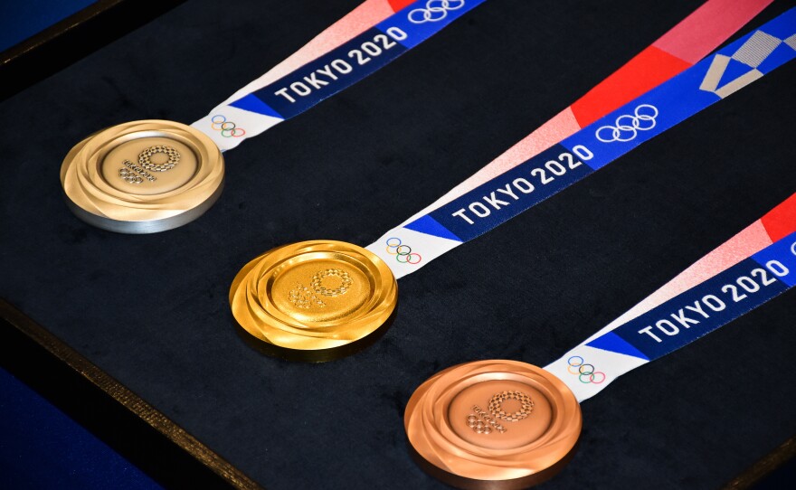 Medal winners at the Tokyo Olympics will place them around their own necks due to safety protocols to prevent the spread of the coronavirus.