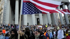 Occupy Wall Street protestors and union members stage a protest near Wall Street in New York, October 5, 2011. The demonstrators are protesting bank bailouts, foreclosures and high unemployment from their encampment in the financial district of New York City. 