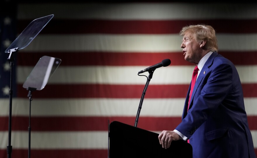 Former President Donald Trump speaks during a rally Sunday, Dec. 17, 2023, in Reno, Nev. In a brief filed Saturday, Trump asked a federal appeals court to dismiss an election interference case against him, arguing he's immune from prosecution.