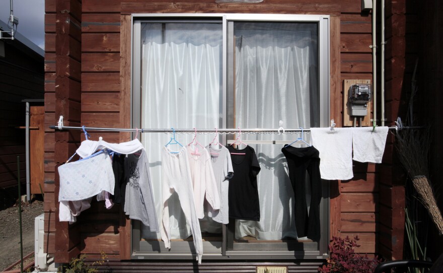 Clothes hang outside the temporary housing in Date city, Fukushima prefecture. In 2011, people would not hang their laundry outside due to the fear of radiation exposure, but now it is common to see.