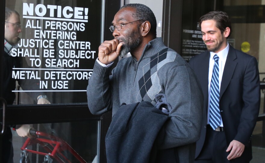 Ricky Jackson is overcome with emotion as he leaves the courthouse.