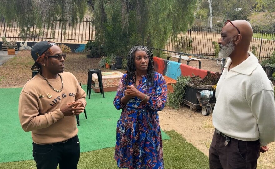 Artist Brandon Flowers, Mvinyo Book Bar's Marilyn Harvey, and Graffiti Gardens' art director Maxx Moses discussing plans for this year's Black Friday Artist Market. Nov. 17, 2025.