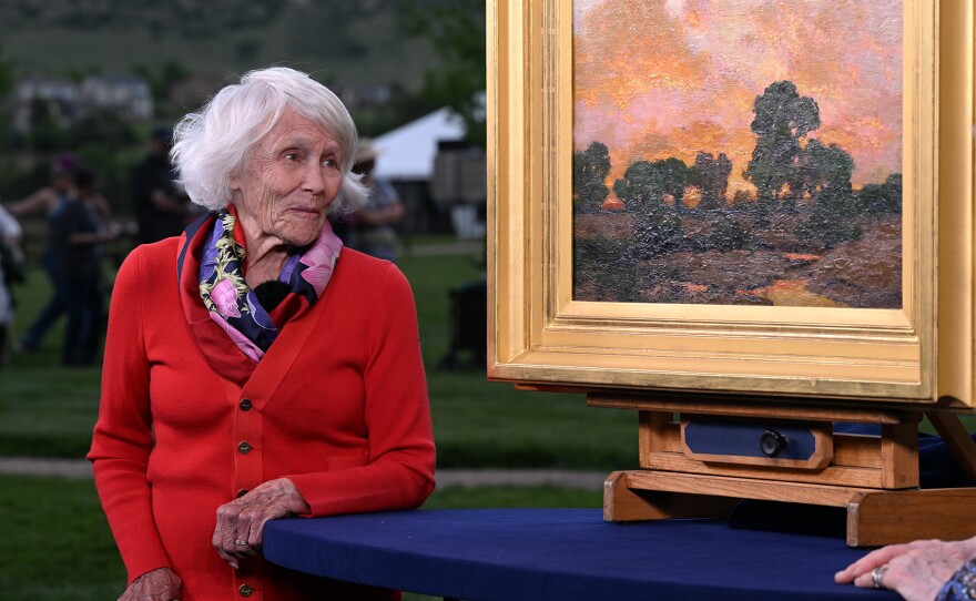A ROADSHOW guest listens as expert Nan Chisholm appraises a Charles Partridge Adams oil painting, ca. 1910, in Littleton, Colo. ANTIQUES ROADSHOW “Junk in the Trunk 14!” airs Monday, May 19 at 8/7C PM on PBS.