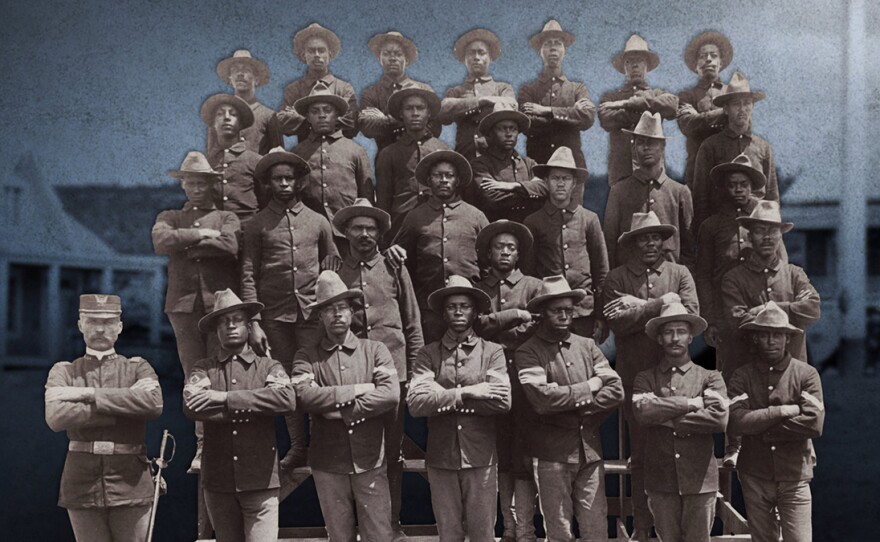 Group portrait of African American soldiers in Co. E, 9th United States Volunteer Infantry, who fought in the Spanish-American War. 