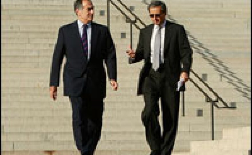 Morgan Stanley CEO John Mack (left) and Citigroup CEO Vikram Pandit leave a meeting at the Treasury Department on Monday. The department said Tuesday that it would buy preferred shares of stock in these two banks, as well as in seven others.