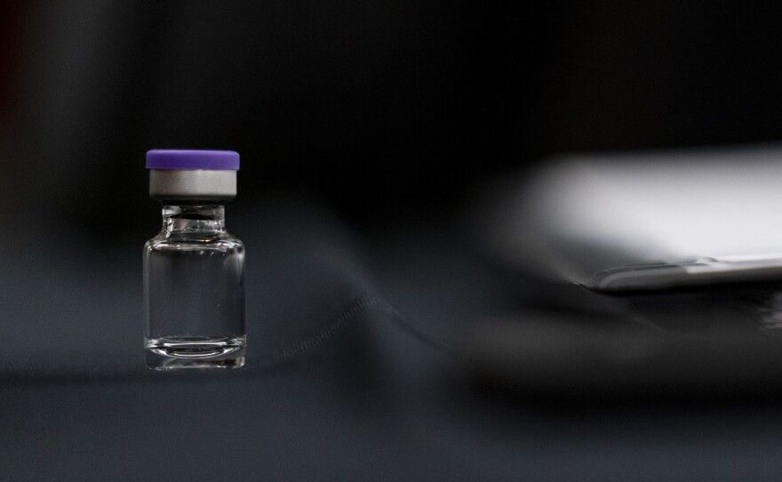 An example of a vial that will carry the COVID-19 vaccine produced by Pfizer and BioNTech sits on display during a Senate subcommittee hearing Thursday.