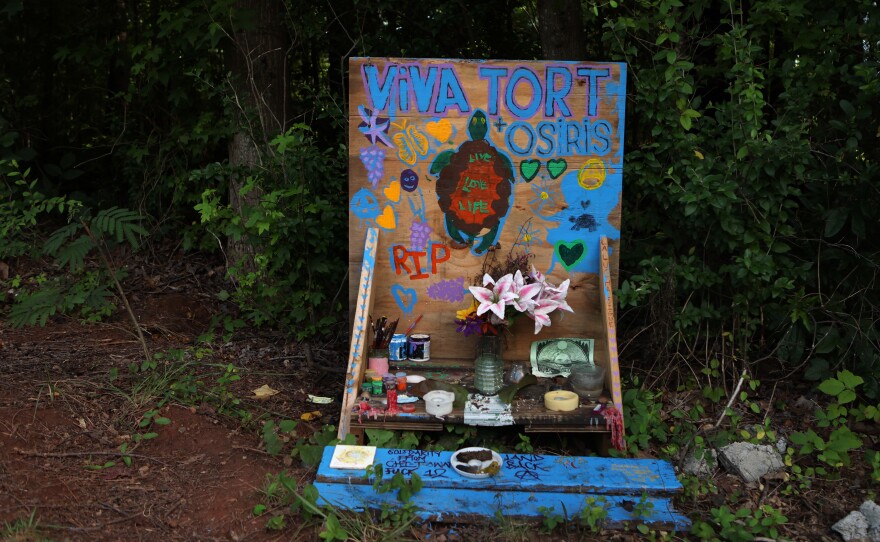 A memorial for Manuel "Tortuguita" Terán, an activist killed by law enforcement, sits near the site of Atlanta Public Safety Training Center that protesters refer to as "Cop City" in Atlanta.