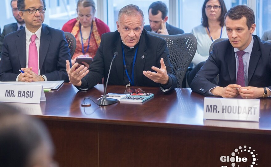 Rev. Albert Ogle discussing LGBT poverty issues with leaders from different countries at this year's World Bank spring meeting.