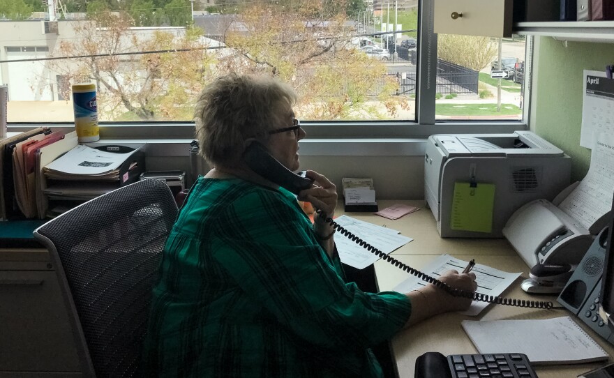 Debbie Sorensen, an infectious disease nurse with Salt Lake County Public Health Department in Salt Lake City, talks by phone with a woman who recently tested positive for the coronavirus. Sorensen is one of the county's 130 contact tracers aiming to slow the spread of COVID-19.
