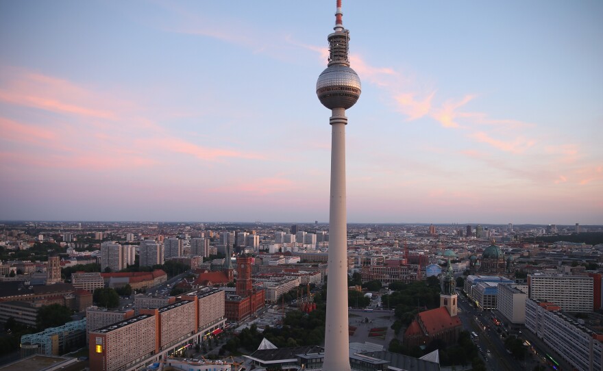 The broadcast tower at Alexanderplatz looms over the city center. A crossing point of tourists, commuters, shoppers, lovers, artists and bums, Alexanderplatz was rebuilt by the communist authorities of former East Germany in the 1960s. Today, it's a popular gathering place in the reunified city.