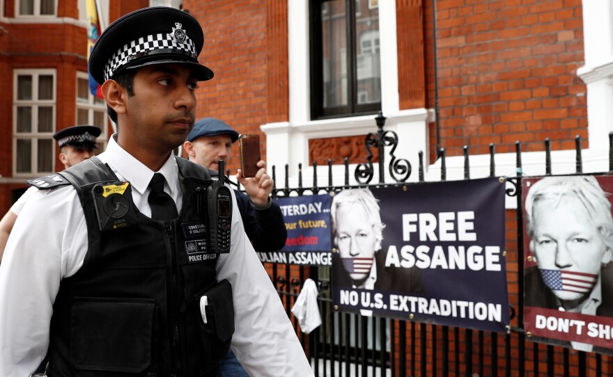 British police officers stand on duty outside the Embassy of Ecuador in London on May 20. Assange was arrested last month after being pushed out the embassy, where he had been living since 2012.