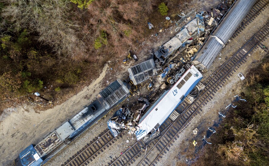 An aerial view of the site in Cayce, S.C., where an Amtrak passenger train (bottom right) slammed into a CSX freight train early Sunday morning. At least two Amtrak crew members were killed and more than 100 people injured, authorities said.