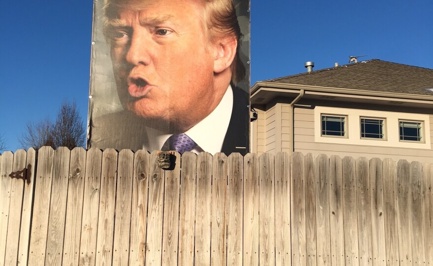 A large photo of Donald Trump, with electric lighting, at the home of George Davey in West Des Moines, Iowa.