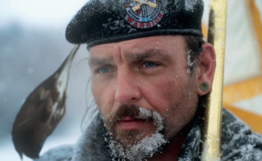 Despite blizzard conditions, Martan Mendenhall, an Army veteran and Blackfoot Indian, joined other military veterans in a march to support the "water protectors" at Oceti Sakowin Camp on Monday.