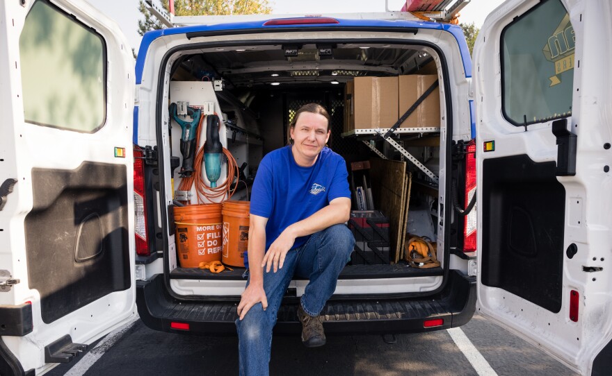 Mat Pergens sits in his work van. He repairs and installs garage doors.