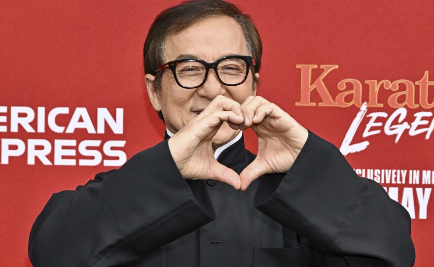 Jackie Chan attends the world premiere of Karate Kid: Legends at the SVA Theatre in 2025 in New York. Chan and his frenetic stunts helped popularize blooper reels in the 1990s.
