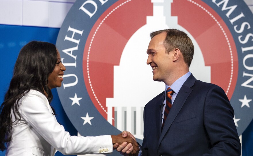 Utah Republican Rep. Mia Love and her Democratic challenger, Salt Lake County Mayor Ben McAdams, shake hands during a debate on Monday, Oct. 15, 2018, in Sandy, Utah