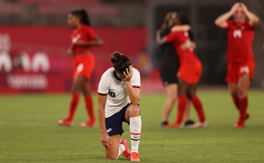 Carli Lloyd of the U.S. women's soccer team looks dejected after Monday's defeat in the semifinal match against Canada at the Tokyo Olympics.