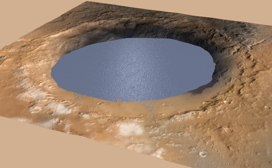 A simulated image shows a lake in the large Gale Crater on Mars, with streams of water flowing into it. NASA researchers believe a lake deposited enough sediment in the crater to form a mountain, Mount Sharp.
