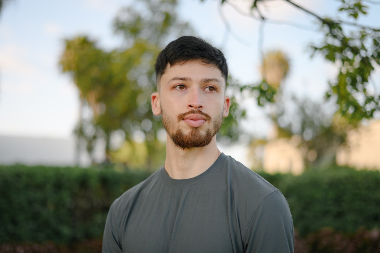 Roberto Umana stands for a portrait at the cemetery where his brother, Brian, is buried in San Diego, California on April 23, 2025. After a three year-legal battle, Roberto and his family’s attorneys won a $1 million settlement from National City for the 2021 police killing of his brother.