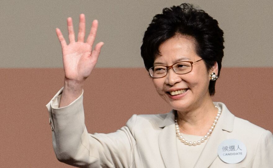 Hong Kong's new chief executive Carrie Lam waves after she won the Hong Kong chief executive election in Hong Kong on March 26, 2017. Hong Kong's new leader Carrie Lam pledged on March 26 to mend political rifts after winning a vote dismissed as a sham by democracy activists who fear the loss of the city's cherished freedoms.