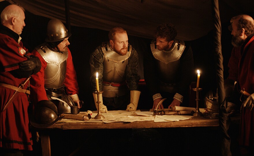 Lord Essex (Charlie Clements) discusses plight with noblemen.