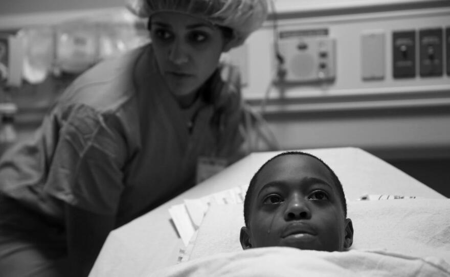 Tavon Tanner tears up before his surgery at Lurie Children's Hospital in October 2016. This photograph is part of the Chicago Tribune series that earned E. Jason Wambsgans the 2017 Pulitzer Prize.