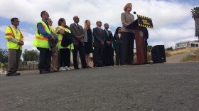 Marnell Gibson, assistant director of San Diego's public works department, addresses a crowd at a ribbon-cutting ceremony on Holly Street in Lincoln Park, May 4, 2015.
