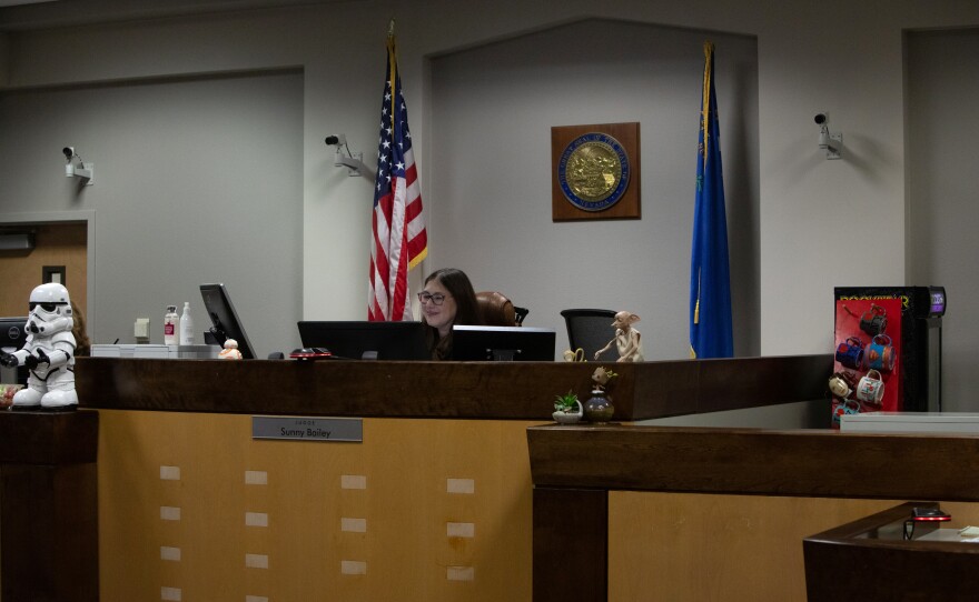 Bailey smiles at a young adult showing progress during DAAY court in Las Vegas.