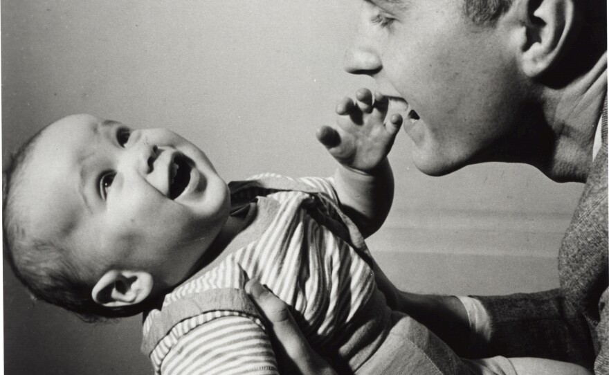 George H.W. Bush holds a young George W. in New Haven, Conn., in April 1947.