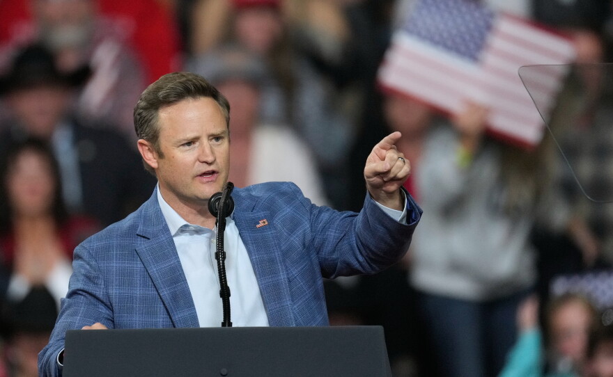 Aaron Flint, the GOP candidate for the House in Montana's 1st District, speaks ahead of an address by President Trump in Kalispell, Mont. on Oct. 14.