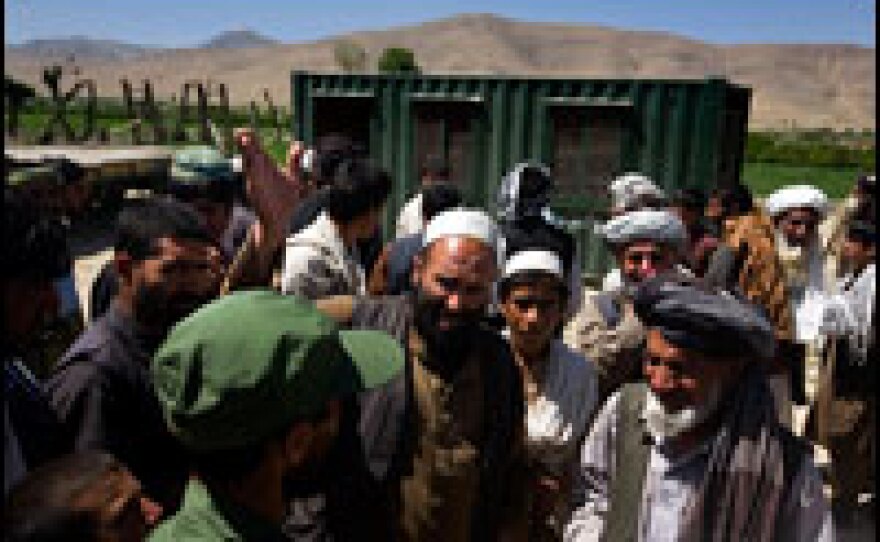 A villager expresses concern over the location of a new Afghan Public Protection Force checkpoint in the village of Khan Ezzat in Nerkh district. Some people in the community believe the checkpoint will bring trouble from the Taliban instead of security.