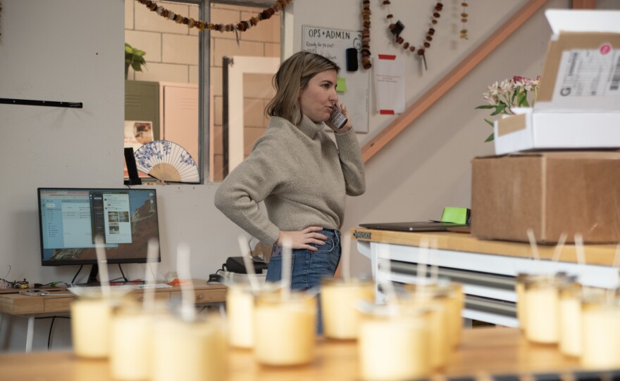 Native Poppy owner Natalie Gill is shown speaking on the phone in her Mission Valley shop on Feb. 21, 2024.