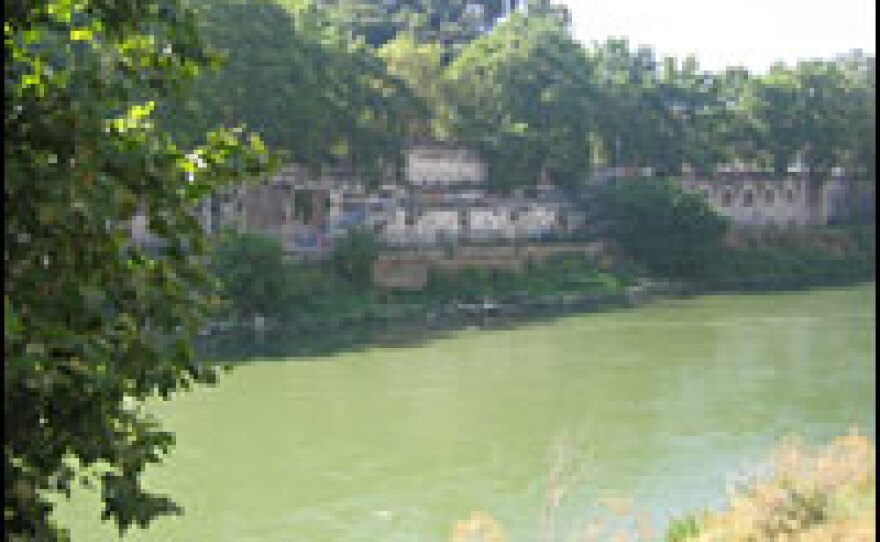 In Rome, the Tiber River flows below the Church of the Kights of Malta on the Aventine Hill.