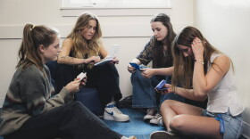 Two teens look at different kinds of birth control with an intern and staff member of Bridgercare in June 2025. Bridgercare, a nonprofit based in Bozeman, Mont., had its federal grant abruptly canceled.