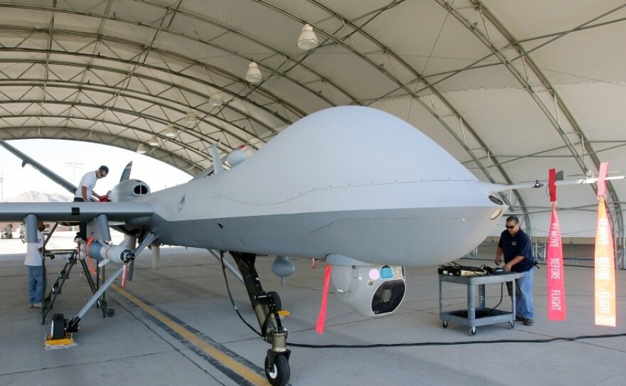 Mechanics prepare an MQ-9 Reaper for a training flight, Aug. 8, 2007, at Creech Air Force Base in Indian Springs, Nev. 