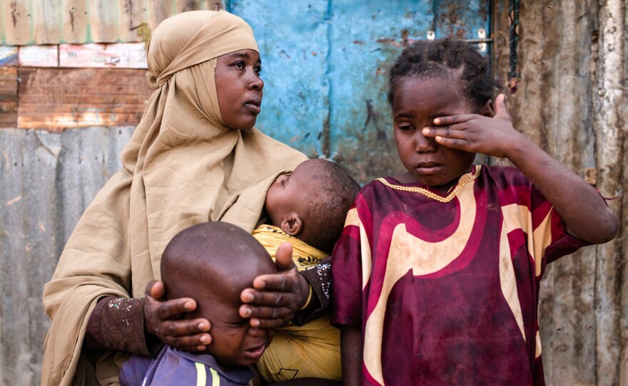 Fatun Mohamed Sareye, 30, sits with her family at a camp for internally displaced people in Garowe, Somalia.