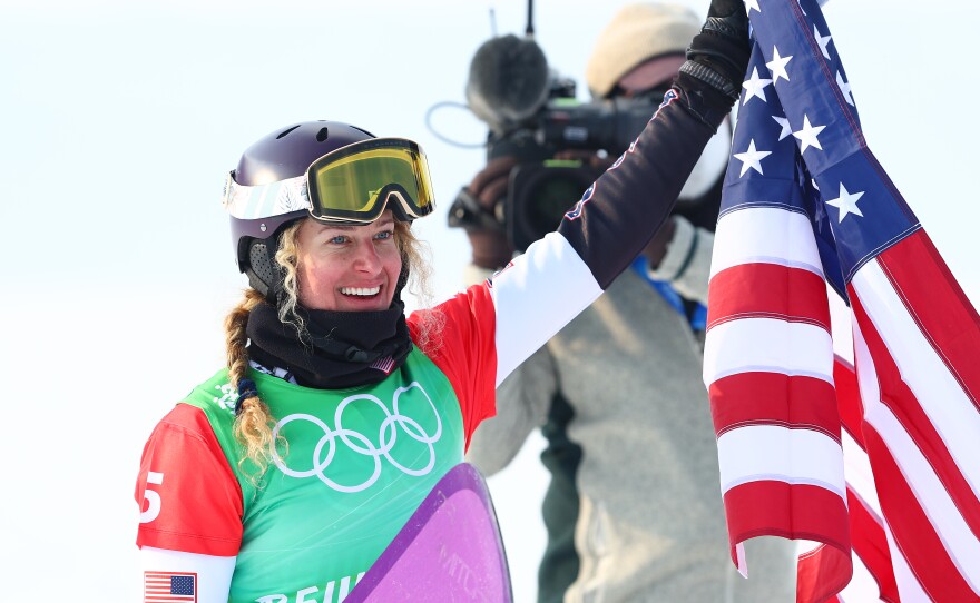 Lindsey Jacobellis wins gold at the women's snowboard cross event at the Beijing Winter Olympics. This is the U.S.'s first gold medal of the Games.
