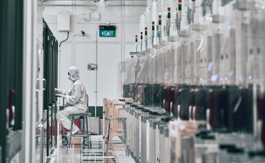 A technician works at a semiconductor fabrication facility in Singapore.